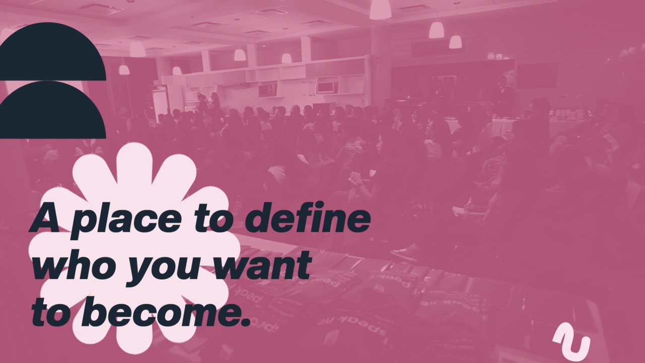 A full-frame duotone shot of a packed conference room with the campaign message set over it